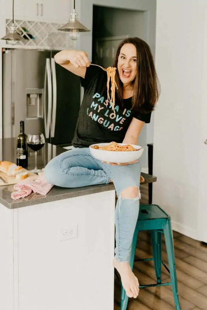 woman in a black shirt that says "pasta is my love language"