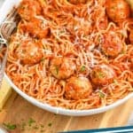 pinterest graphic of bowl of spaghetti with chicken meatball recipe all covered in sauce