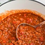 a pot of sauce, says "30 minute spaghetti meat sauce, simplejoy.com"