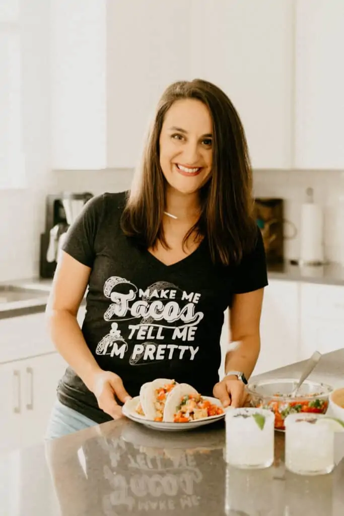 woman in a v neck shirt that says "make me tacos and tell me I'm pretty"