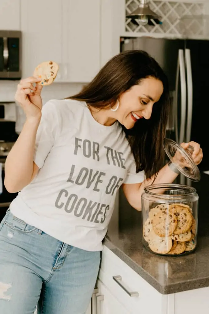 woman in a white t-shirt that says "for the love of cookies"