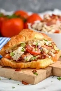 blt chicken salad sandwich on a croissant