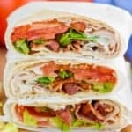 a stack of blt wraps cut in half - 8