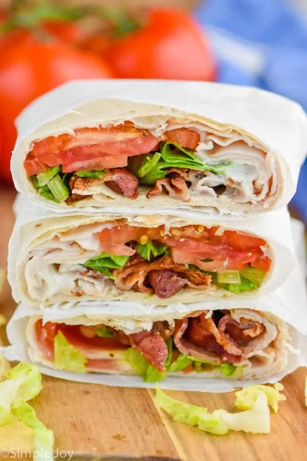 a stack of blt wraps cut in half