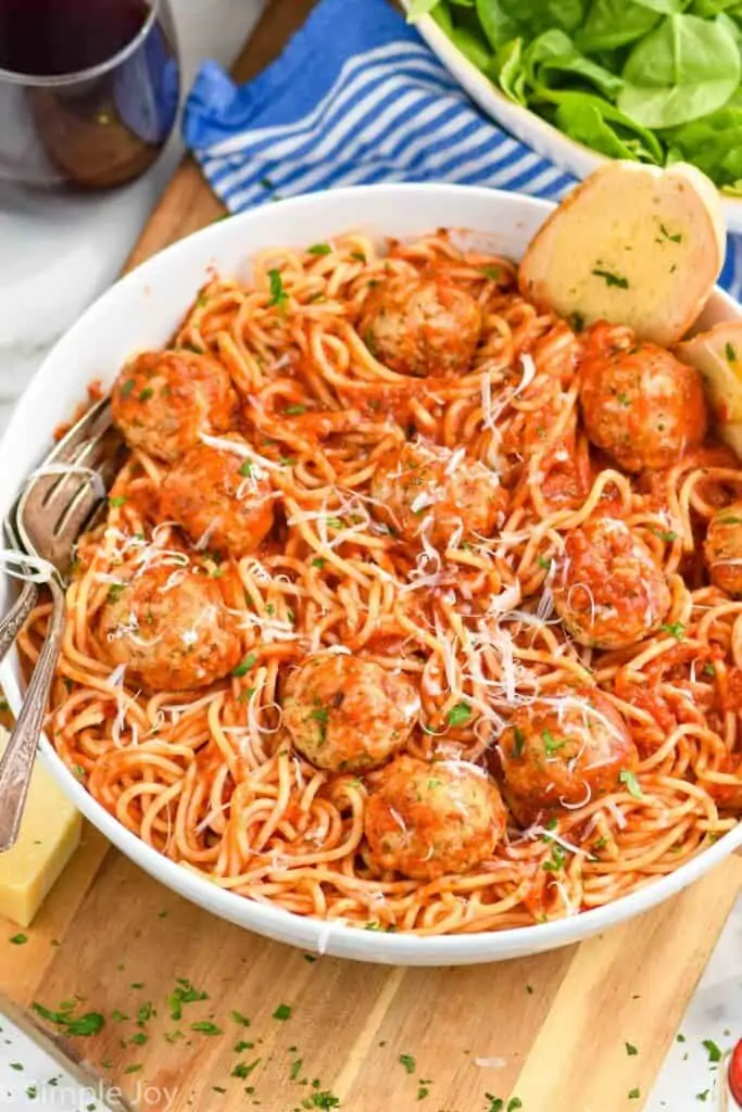 bowl of spaghetti with chicken meatball recipe all covered in sauce