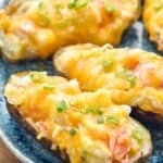 close up of a crab twice baked potato on a plate - 10
