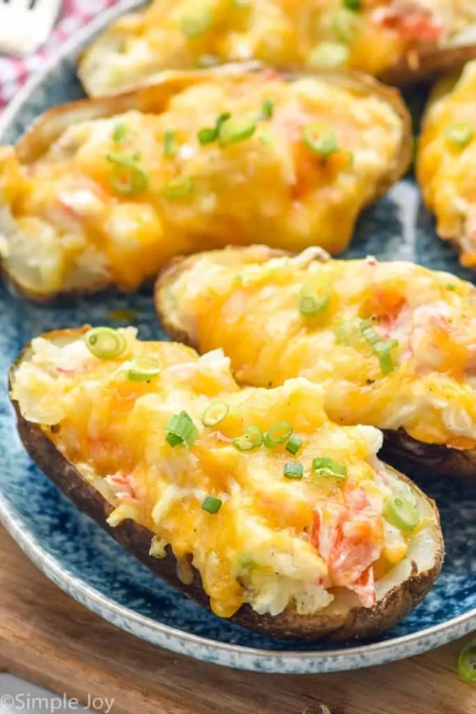 close up of a crab twice baked potato on a plate