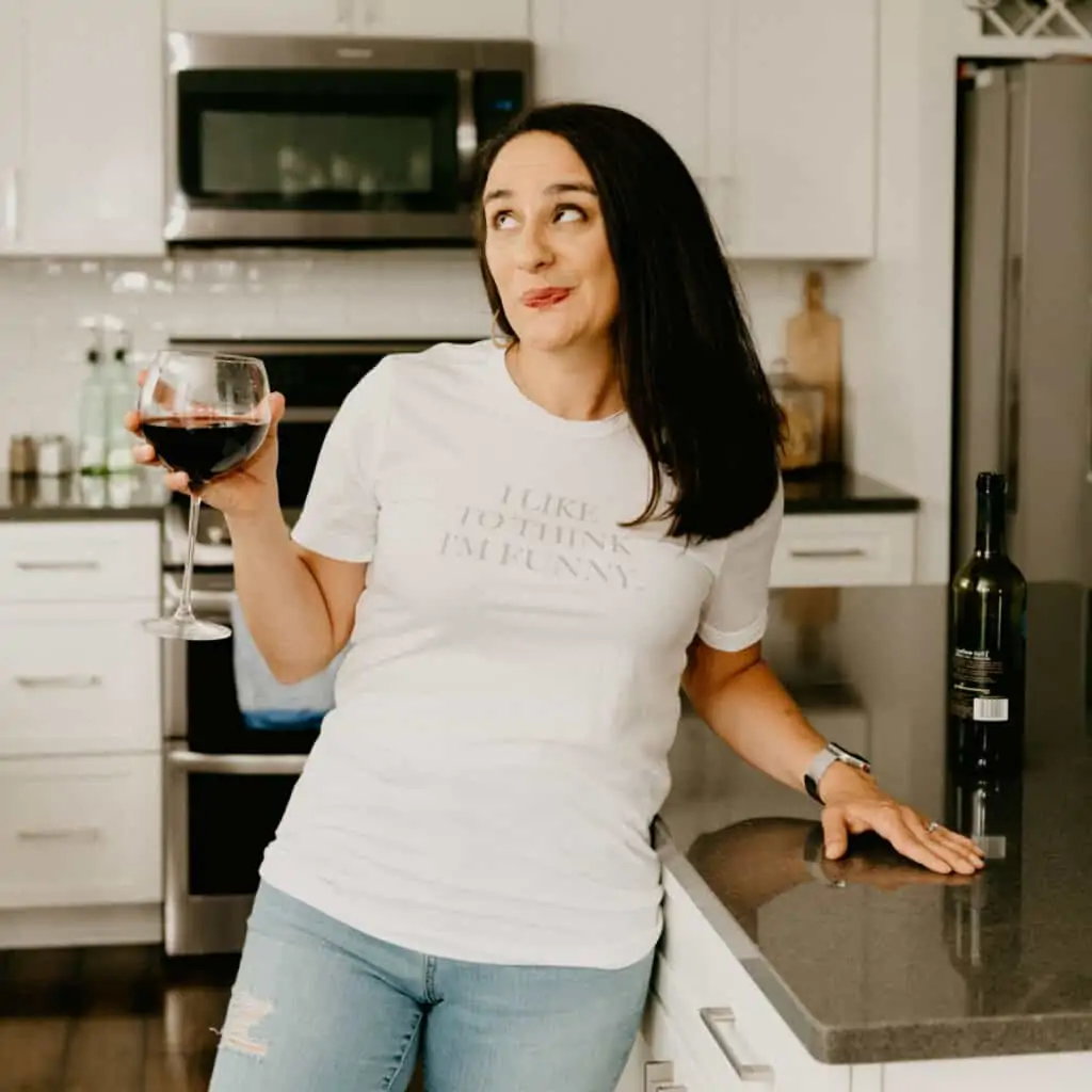 woman in a white shirt that says "I like to think I'm funny"