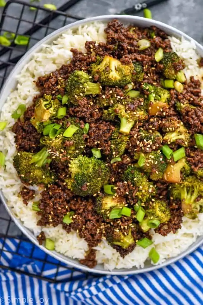 overhead of ground beef and broccoli recipe in a bowl over rice