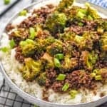 side view of a bowl of ground beef and broccoli over rice