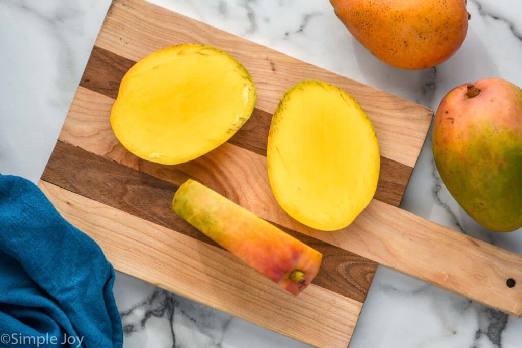 a mango with both sides of the pit cut off