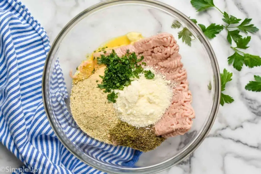 overhead of a bowl of ingredients for baked chicken meatballs