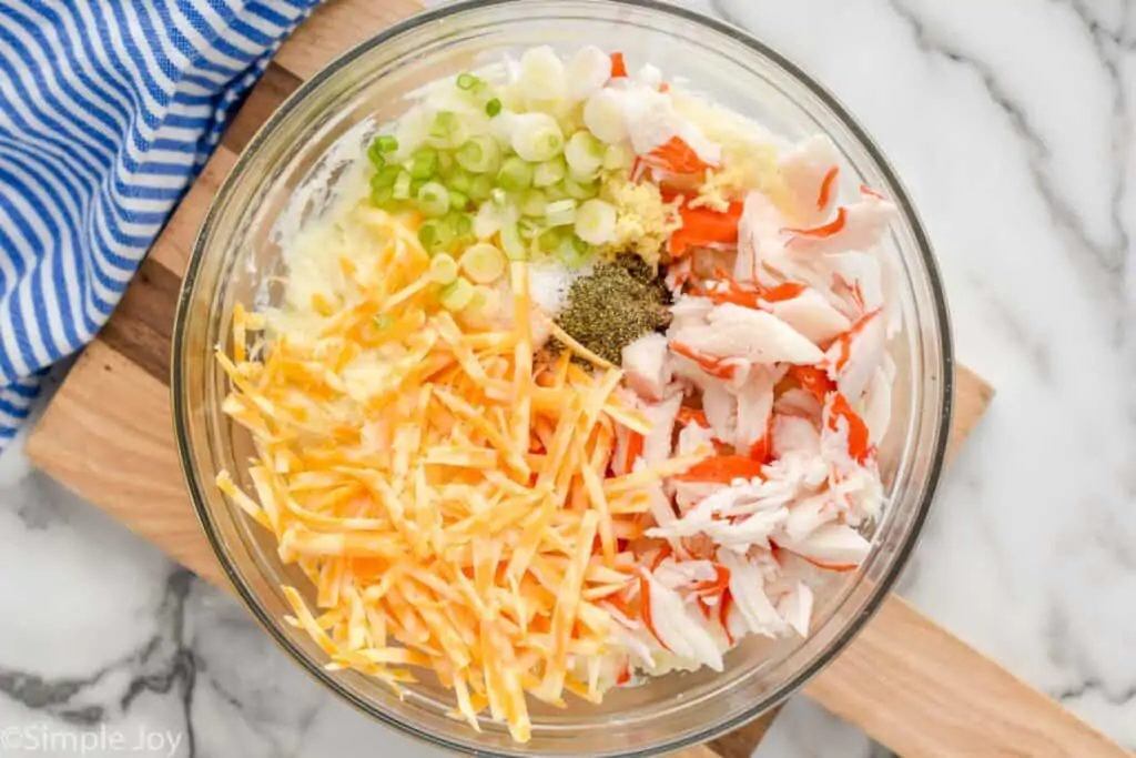 overhead of a bowl of filling to make crab twice baked potatoes