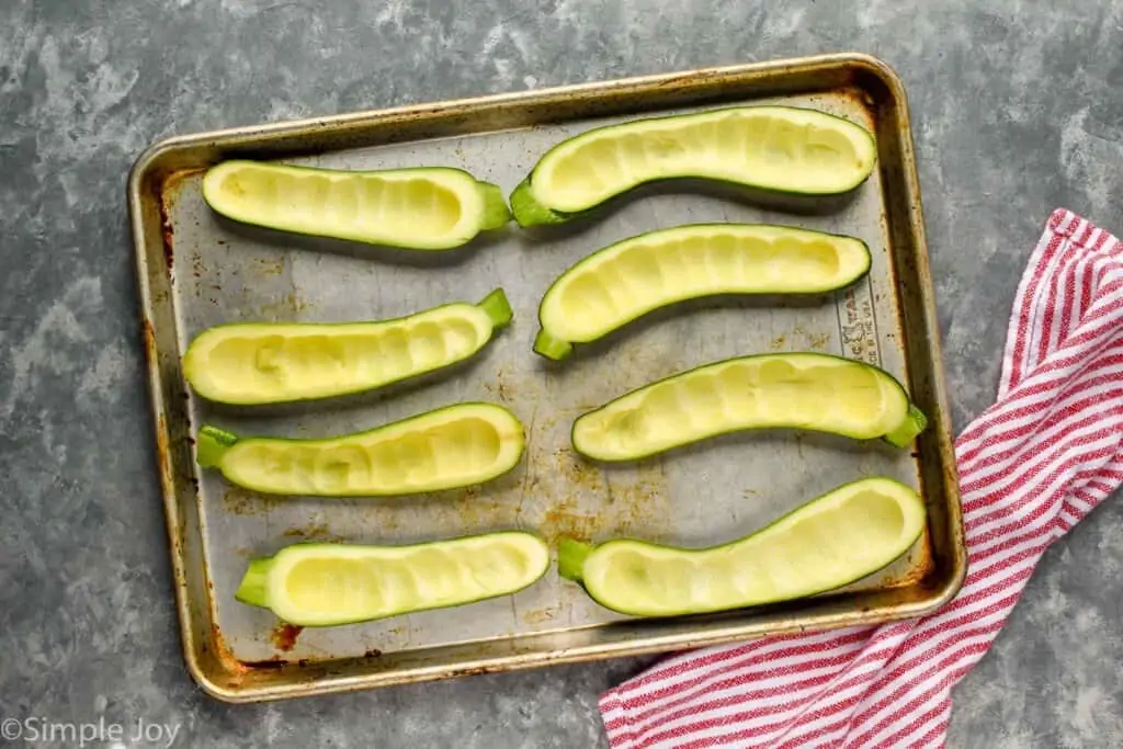 overhead of a zucchini that have been hollowed out for zucchini boats