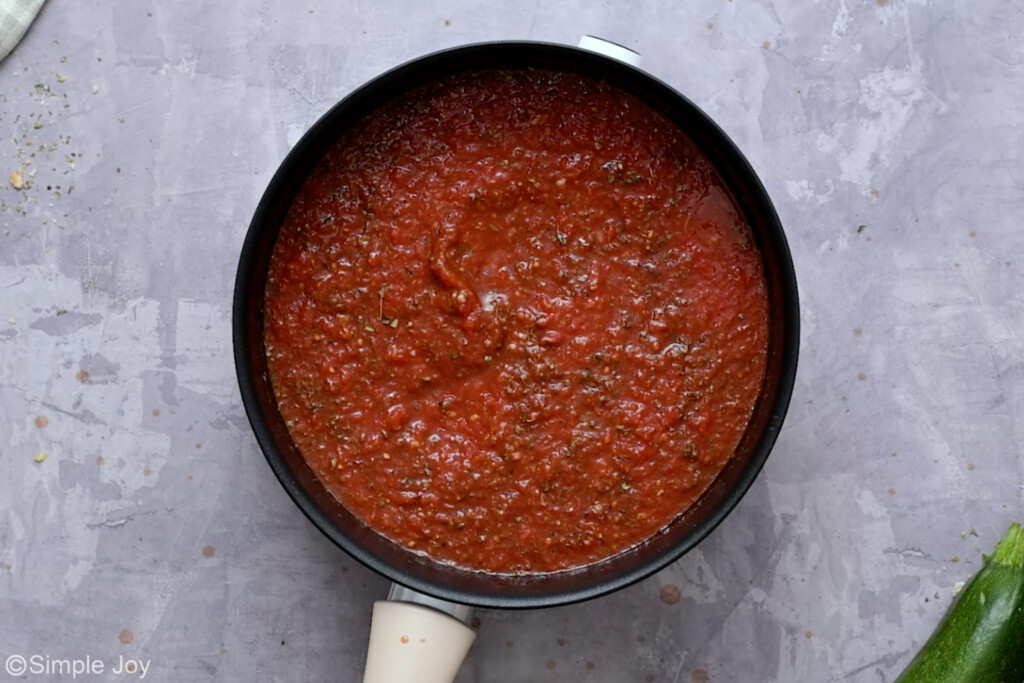overhead of a pot making a tomato sauce - 9