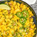 pinterest graphic of overhead of a bowl of mango salsa