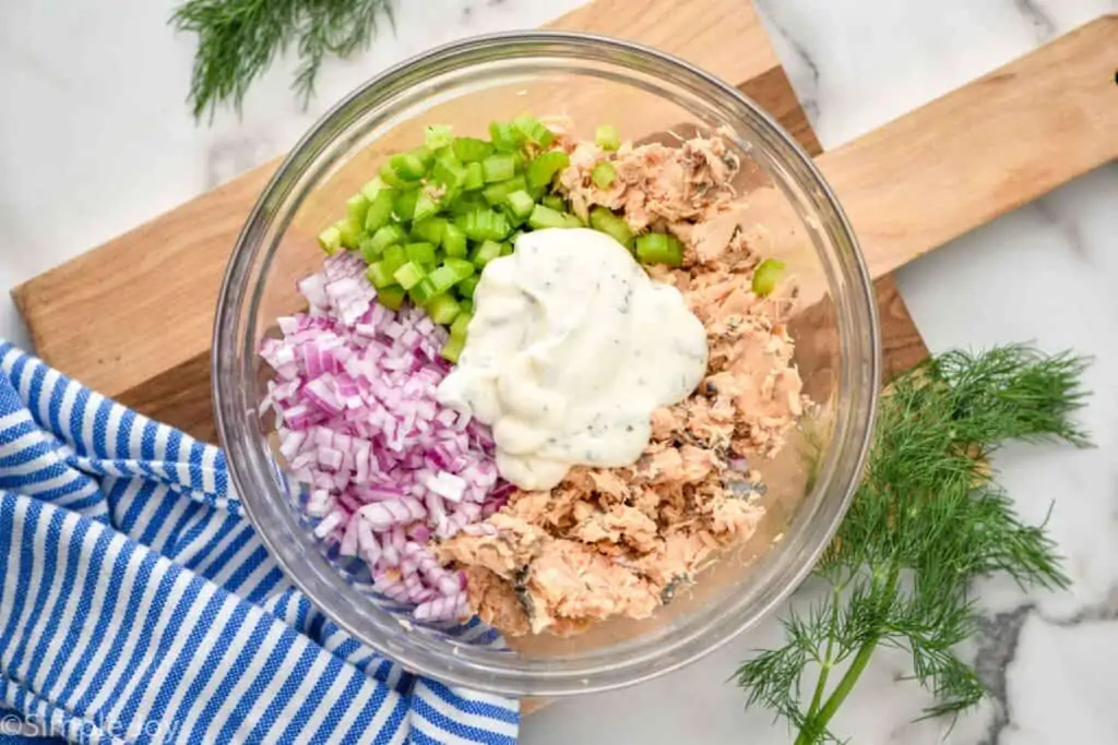 overhead of a bowl of ingredients to make canned salmon salad