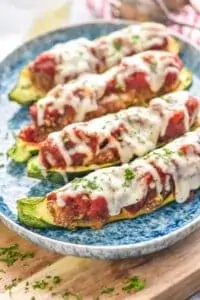 four zucchini boats on a plate