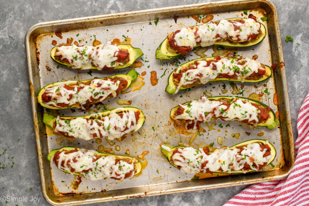 overhead of zucchini boats cooked on a pan - 10