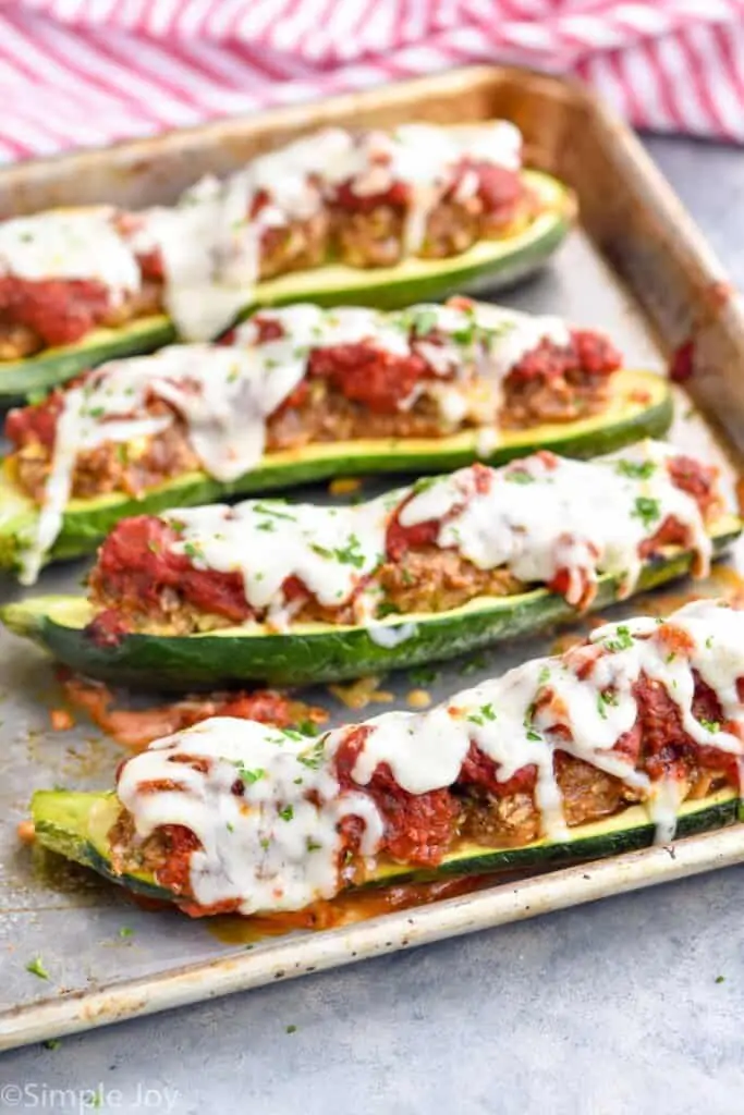 zucchini boats recipes on a rimmed baking sheet