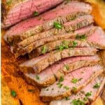 pinterest graphic of a London broil cut up on a cutting board