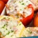 Pinterest graphic of close up of a quinoa stuffed pepper in a baking dish