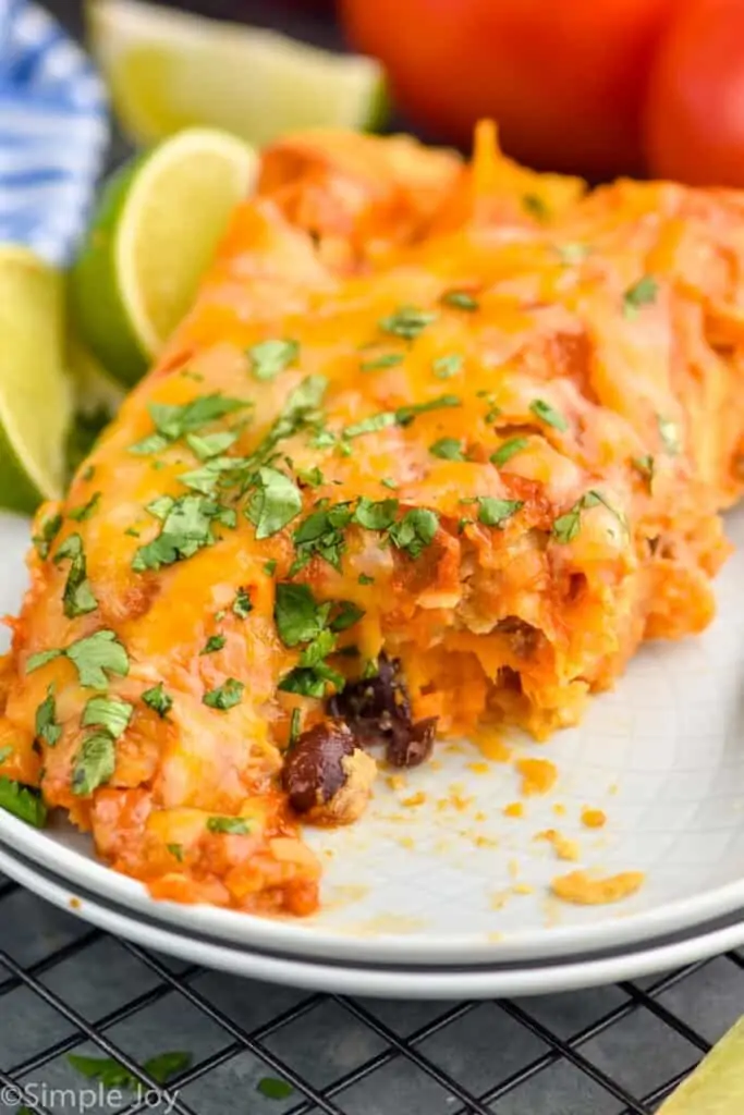 close up of black bean enchiladas that have been cut into