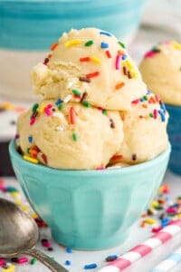 a small bowl filled with scoops of edible sugar cookie dough
