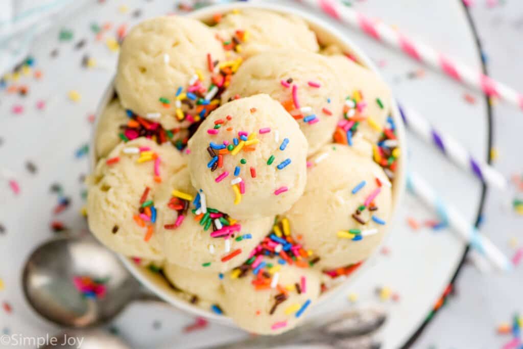 overhead photo of scoops of edible sugar cookie dough without brown sugar in a a bowl