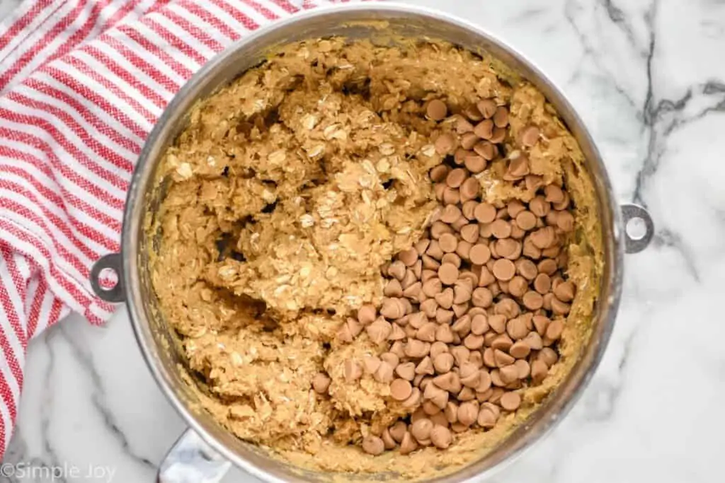 overhead of a mixing bowl full of dough for oatmeal butterscotch cookies 