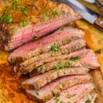 a London broil cut up on a cutting board - 9