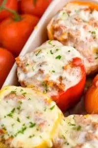 close up of a quinoa stuffed pepper in a baking dish