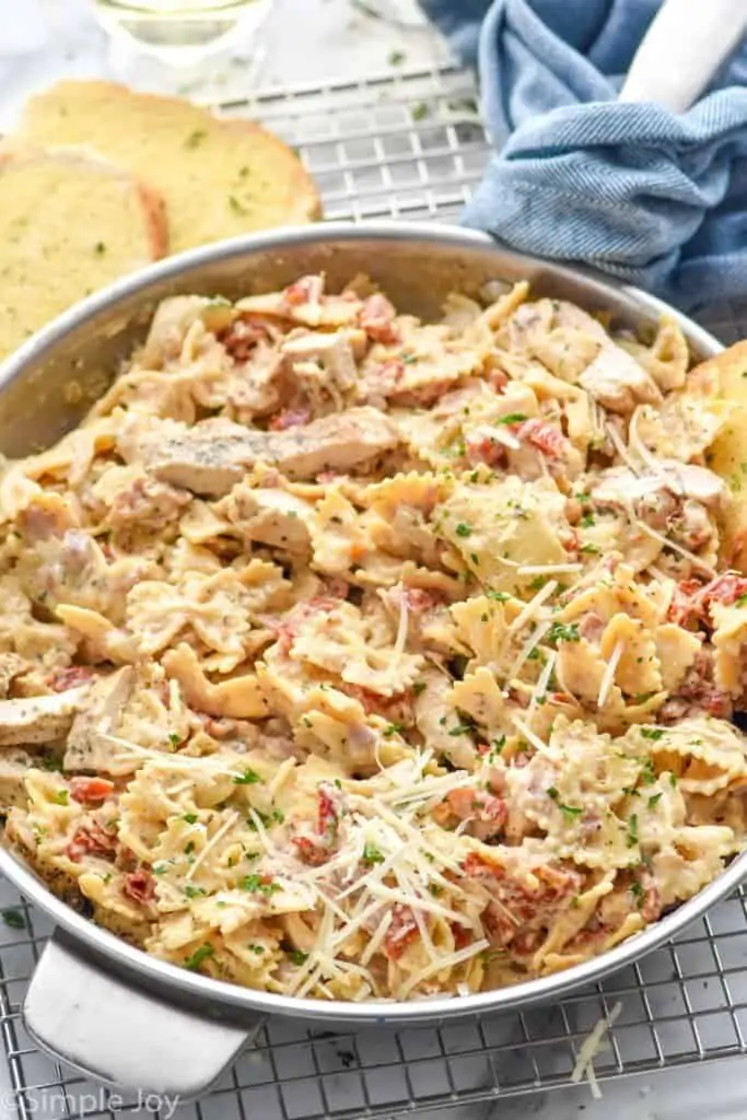 side view of a sun dried tomato pasta recipe in a skillet