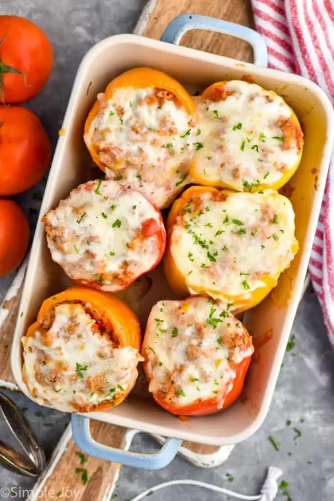 overhead of six stuffed peppers in a baking dish