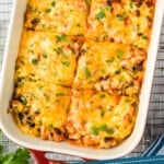 pinterest graphic of overhead of a chicken enchilada casserole in a baking dish