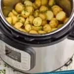 pinterest graphic of instant pot baby potatoes in a pressure cooker