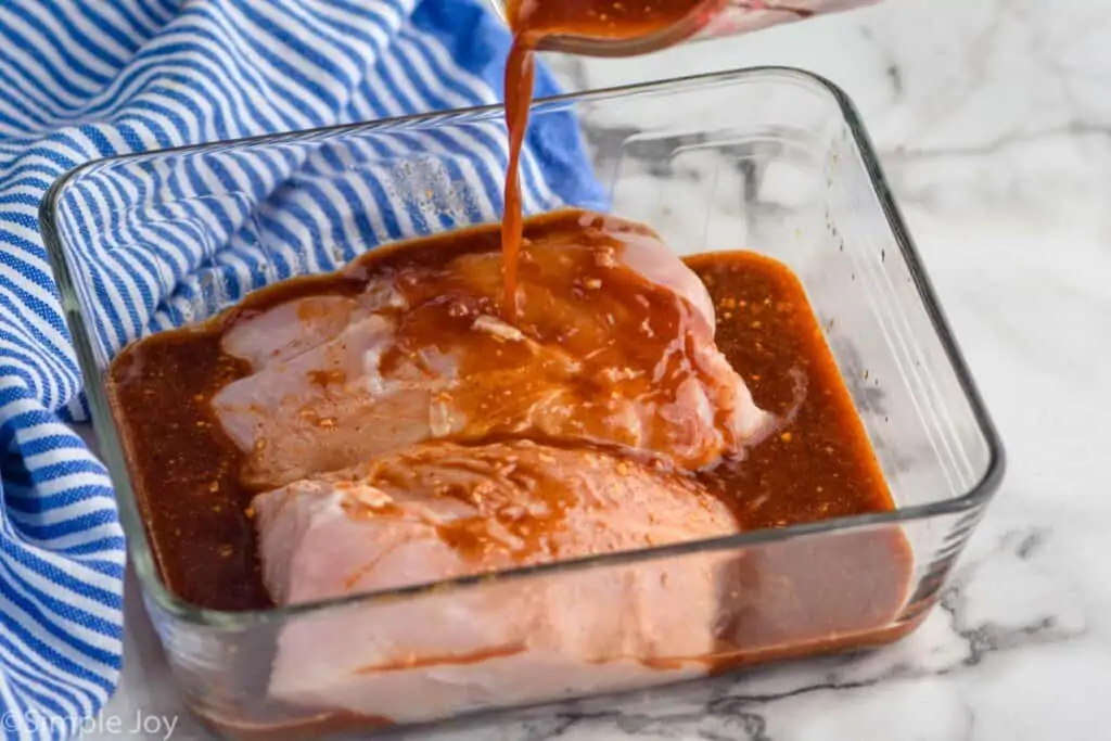 marinade being poured over turkey tenderloin