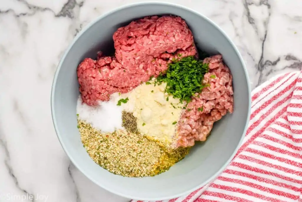 overhead of ingredients for crockpot meatballs in a bowl