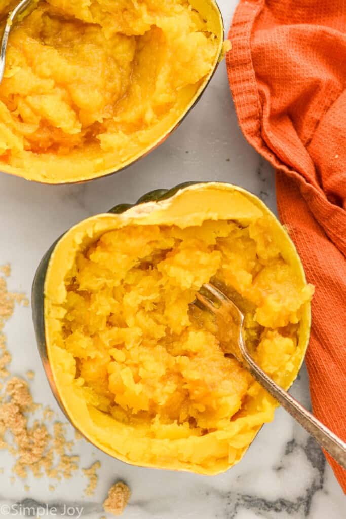 overhead picture of instant pot acorn squash that has been cooked and mashed inside the shell