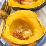 a cooked acorn squash with butter and brown sugar in it