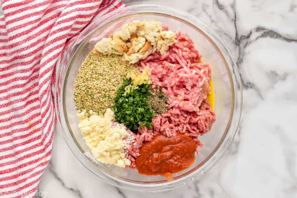 overhead of a bowl full of ingredients to make italian meatloaf