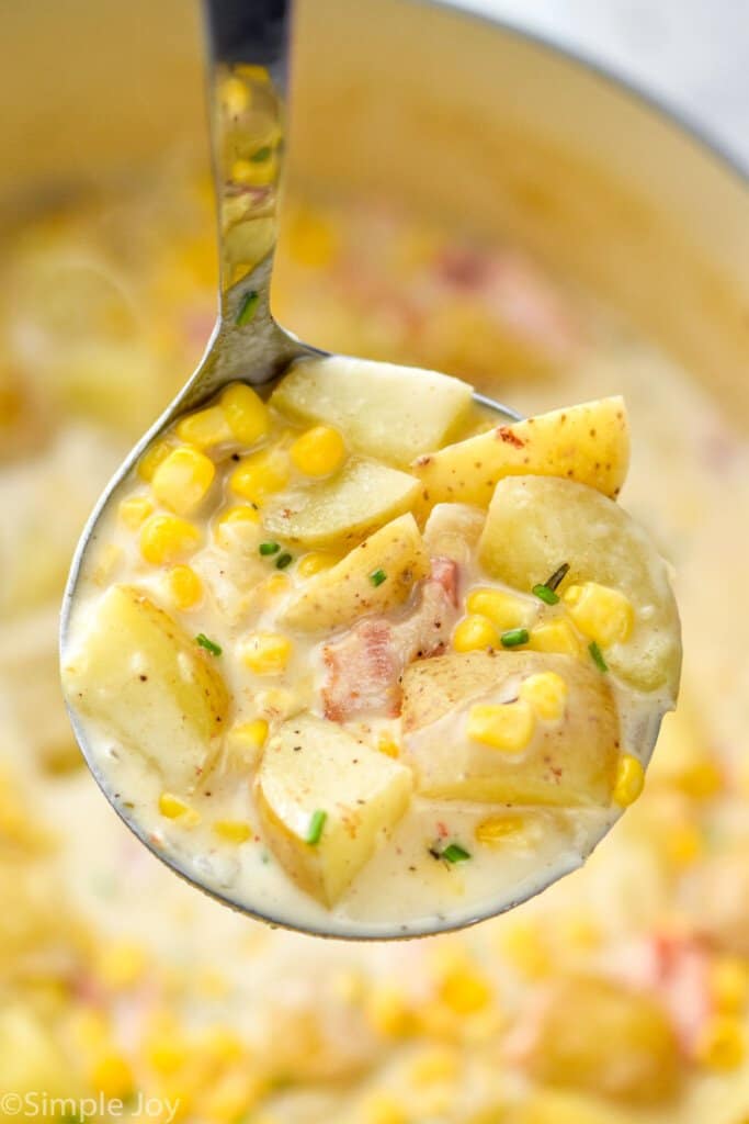 a ladle full of potato and corn chowder