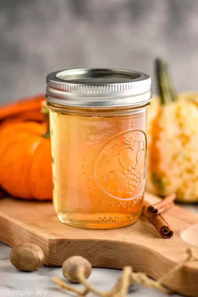 a small mason jar full of pumpkin spice coffee syrup