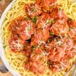 overhead ov a slow cooker meatball recipe over spaghetti