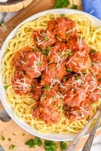 overhead ov a slow cooker meatball recipe over spaghetti