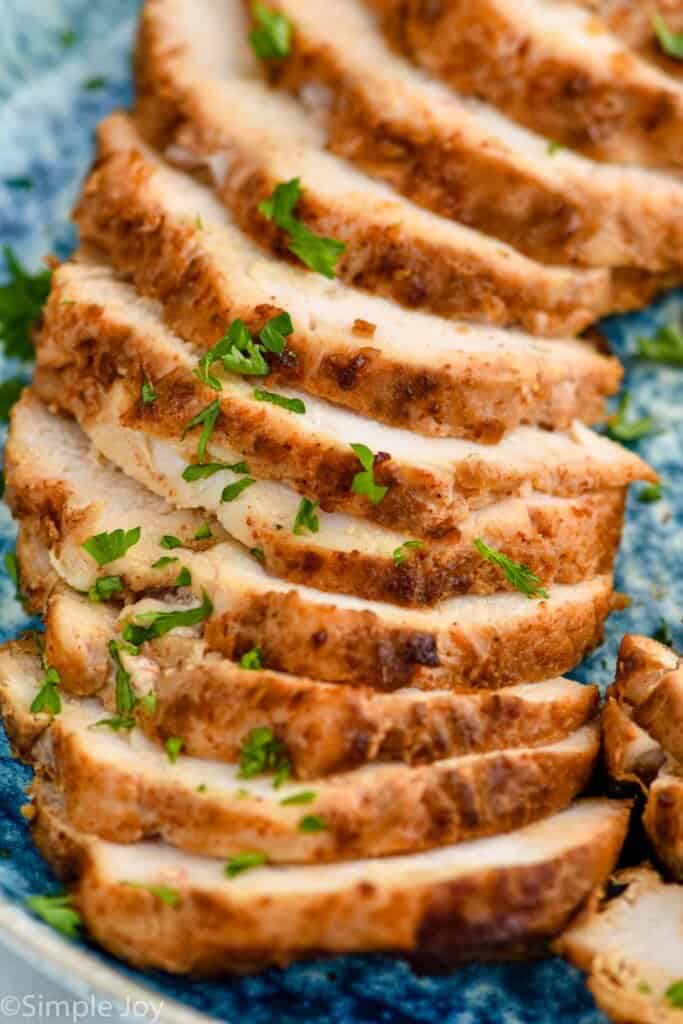 close up of turkey tenderloin recipe sliced on a platter