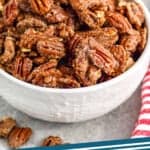 pinterest graphic of small white bowl full of candied pecans