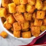 pinterest graphic of overhead of bowl full of croutons
