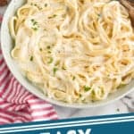 pinterest graphic of a bowl of fettuccine alfredo garnished with parsley