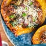 pinterest graphic of overhead picture of a sausage stuffed acorn squash
